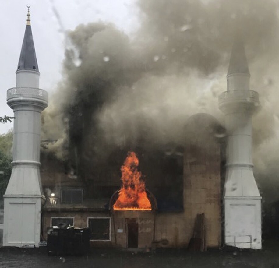 In this photo provided by Lina Biroscak, a fire burns at a mosque, Sunday, May 12, 2019, in New Haven, Conn.